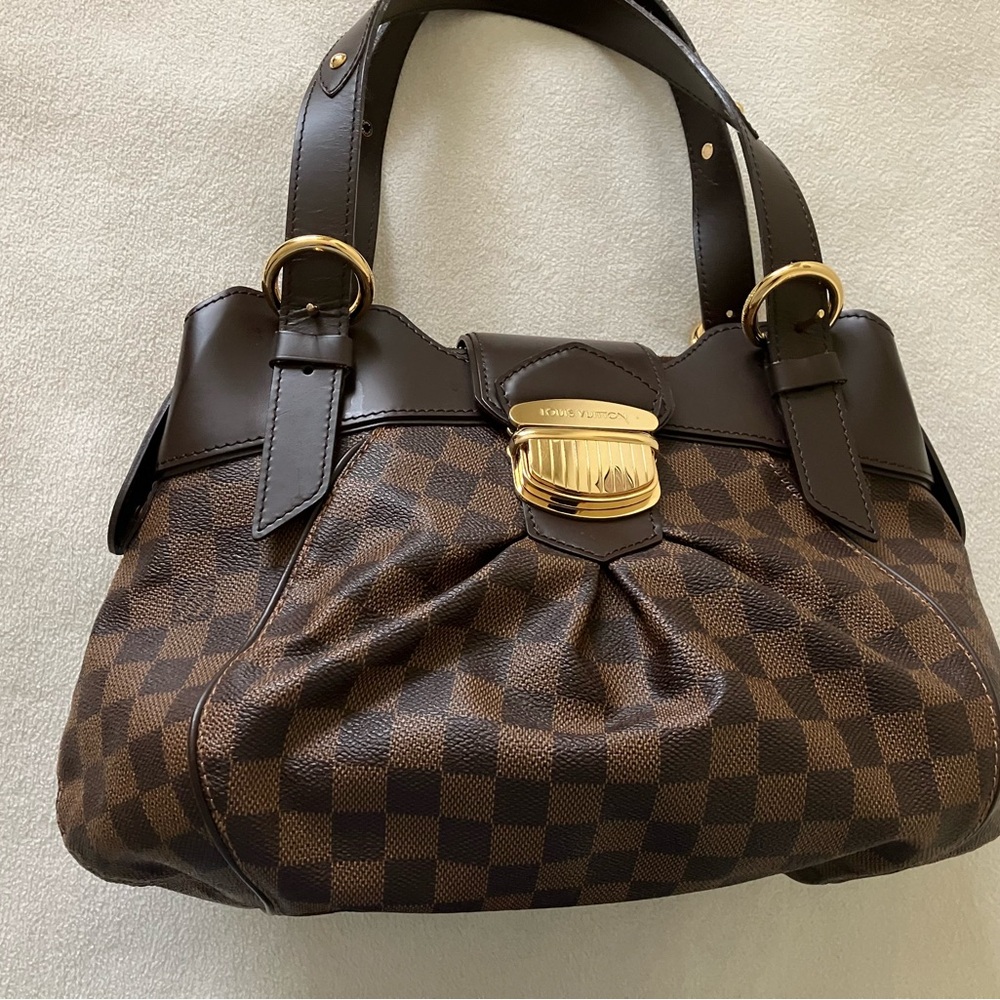 Louis Vuitton Damier Ebene Sistina PM
Size 14x9x6”
The item was used only once.